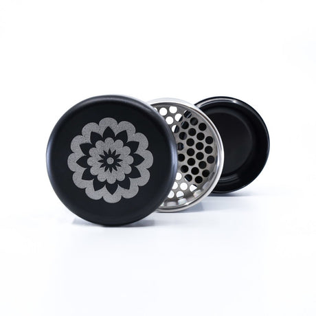 black and grey flowermill 2.5 premium herb grinder with white flowermill branding in 3 separate sections on white background