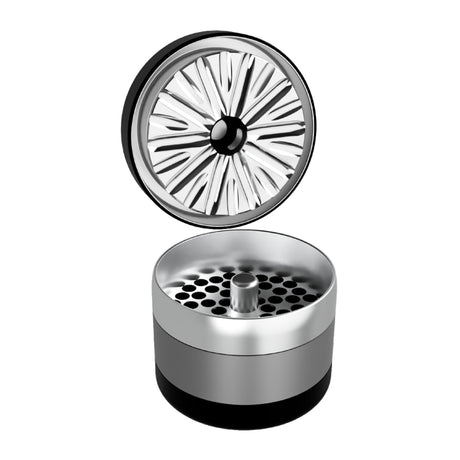  black and grey flowermill 2.5 premium herb grinder with top section removed on white background