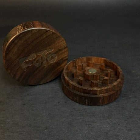 walnut futo herb grinder in 2 sections on dark grey background