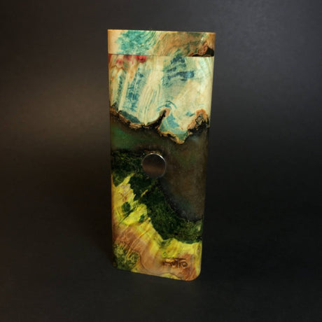 galaxy burl futostash for dynavap in green/blue/yellow shades stood upright on grey background