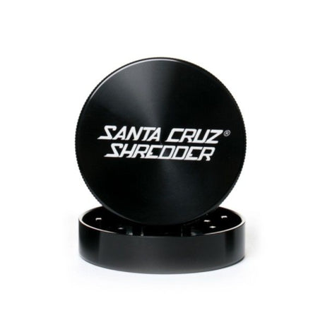 large gloss black santa cruz 2 piece herb grinder with top section sat atop the bottom section set on white background