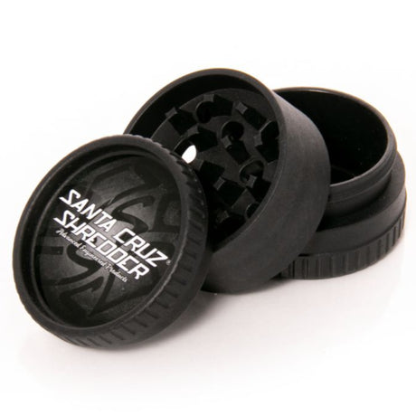 black santa cruz shredder hemp made 3 piece herb grinder in 3 sections set on white background