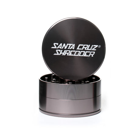 large gloss grey 3 piece santa cruz shredder herb grinder with the lid section sitting on top of the base. Santa Cruz logo on lid set on white background