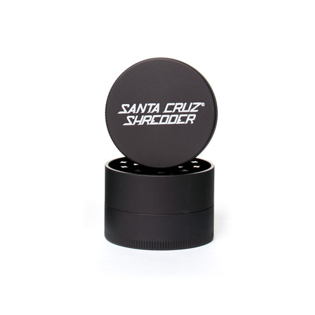 medium matt Grey 3 piece santa cruz shredder herb grinder with the lid section sitting on top of the base. Santa Cruz logo on lid set on white background