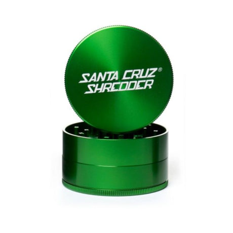 large gloss green 3 piece santa cruz shredder herb grinder with the lid section sitting on top of the base. Santa Cruz logo on lid.