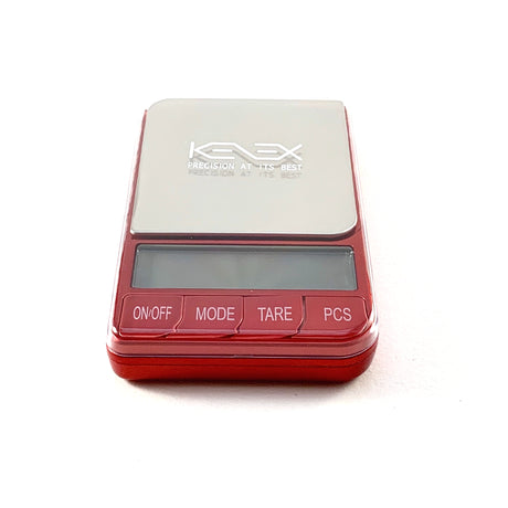 red kenex omega platinum collection scales sat on white background