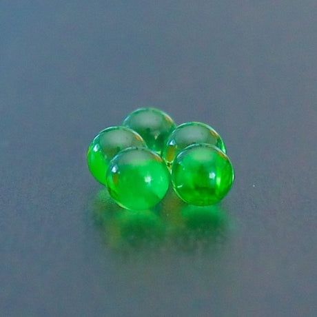 close up of sneaky pete xl terp pearls in green sat on grey surface